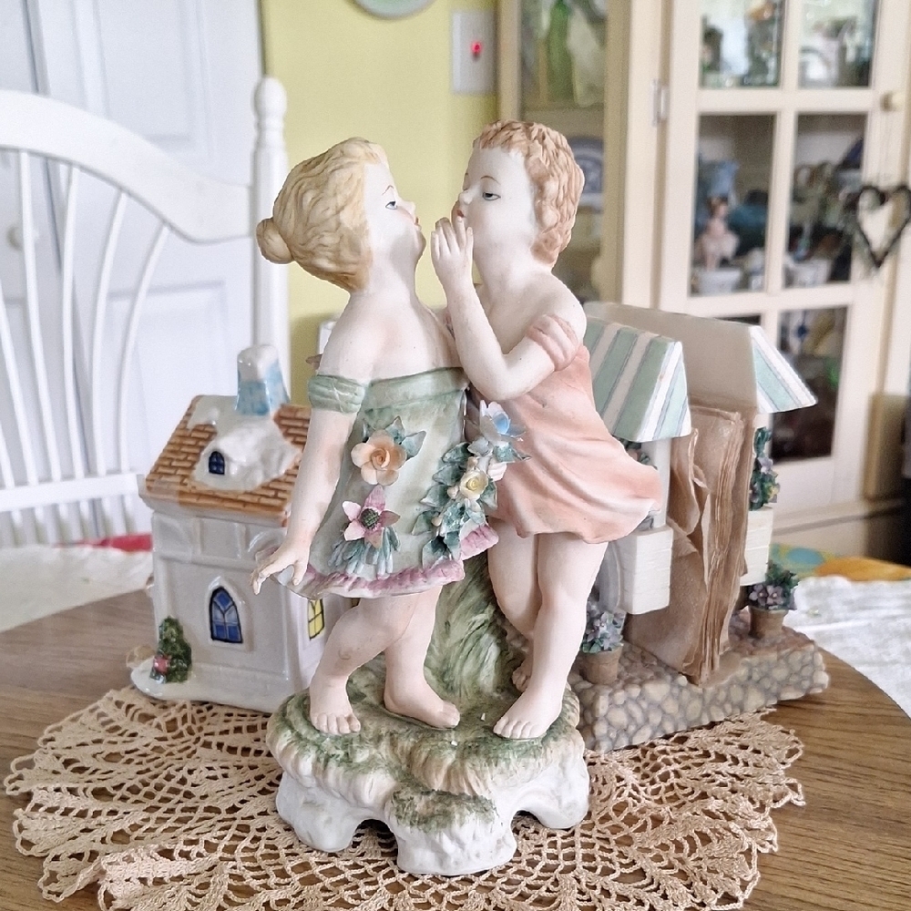 Charming Porcelain Figurine with Floral Accents